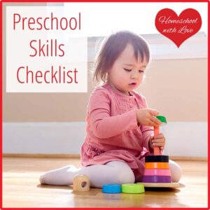 Little girl playing with stacking circles. Preschool Skills Checklist.