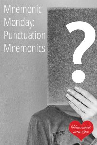 Man holding card with question mark - Mnemonic Monday: Punctuation Mnemonics