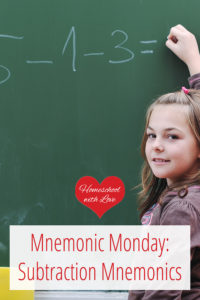 Girl doing subtraction problem on chalkboard - Subtraction Mnemonics